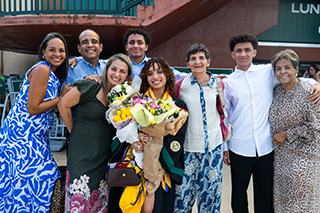 Family poses outside commencement