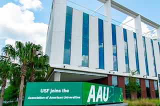 AAU sign outside research building