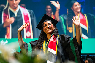 Student crosses stage at commencement