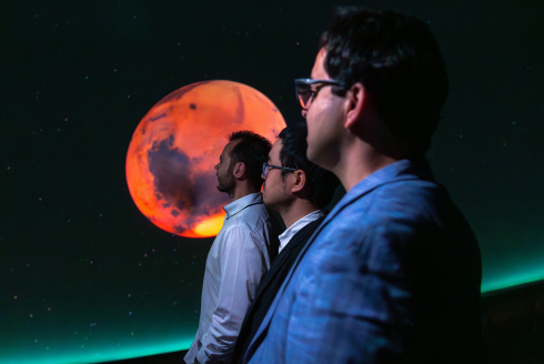 Team of researchers staring off into space.